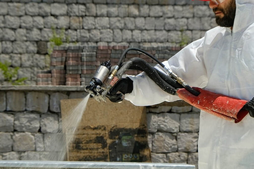 A man is Spraying Foam Insulation in Kent, WA